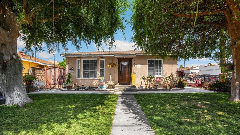 Historic Downtown La Habra home with mature trees and front lawn